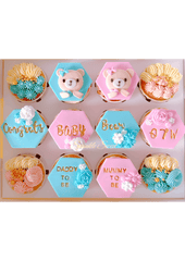 Teddy Bear-themed cupcakes in light blue and pink colors for baby shower party 